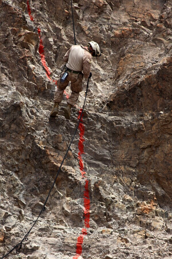 A Marine with Bravo Company, Battalion Landing Team 1st Battalion, 2nd Marine Regiment, 24th Marine Expeditionary Unit, rappels from a 150 ft. cliff during assault climber training in Djibouti, Aug. 29, 2012. The training is a part of a Training Force, or T-Force, package focused on primitive infantry skills. The 24th MEU is deployed with the Iwo Jima Amphibious Ready Group as a theater reserve and crisis response force throughout the U.S. Central Command in the Navy's 5th Fleet area of responsibility.