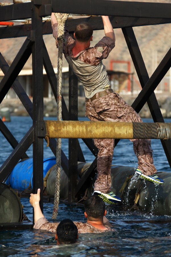 Marines with Bravo Company, Battalion Landing Team 1st Battalion, 2nd Marine Regiment, 24th Marine Expeditionary Unit, navigate an obstacle during a water obstacle course in Djibouti, Aug. 30, 2012. The course is a part of a Training Force, or T-Force, package focused on primitive infantry skills. The 24th MEU is deployed with the Iwo Jima Amphibious Ready Group as a theater reserve and crisis response force throughout the U.S. Central Command in the Navy's 5th Fleet area of responsibility.