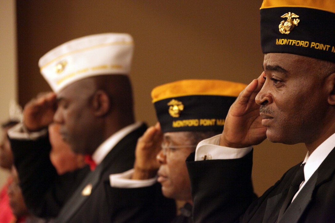 Members of the Montford Point Marine Association render respects during the annual Montford Point celebration aboard Marine Corps Base Camp Lejeune Aug. 25. 