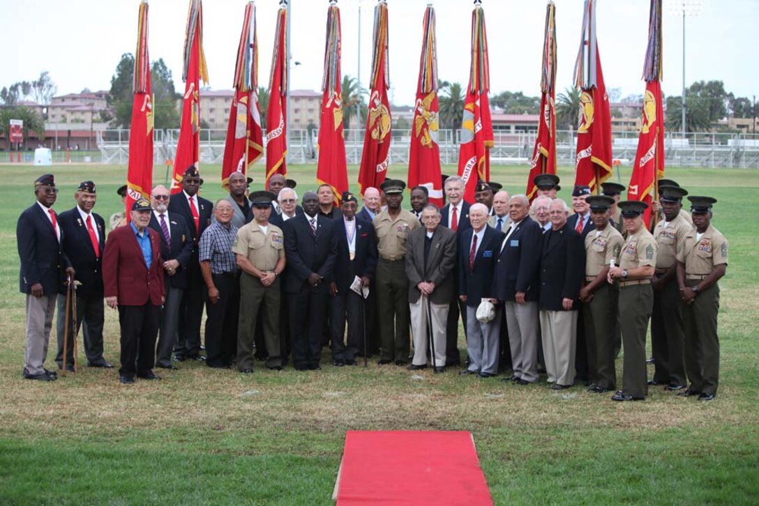 Veterans and Marines stand with Maj. Gen. Ronald L. Bailey, the 1st Marine Division commanding general, after a battle color rededication ceremony on the division parade field here, Aug. 30. Bailey fastened 25 streamers to the battle color signifying various campaigns, expeditions, battles, and decorations presented to the division since its founding, from the occupation of Haiti in 1915 to Operation Enduring Freedom in Afghanistan. The ceremony was directed by the commanding general of the 1st Marine Division as a part of the Commandant’s guidance to refocus Marines on their core values and identity.
(U.S. Marine Corps photo by Cpl. Sarah B. Novotny)