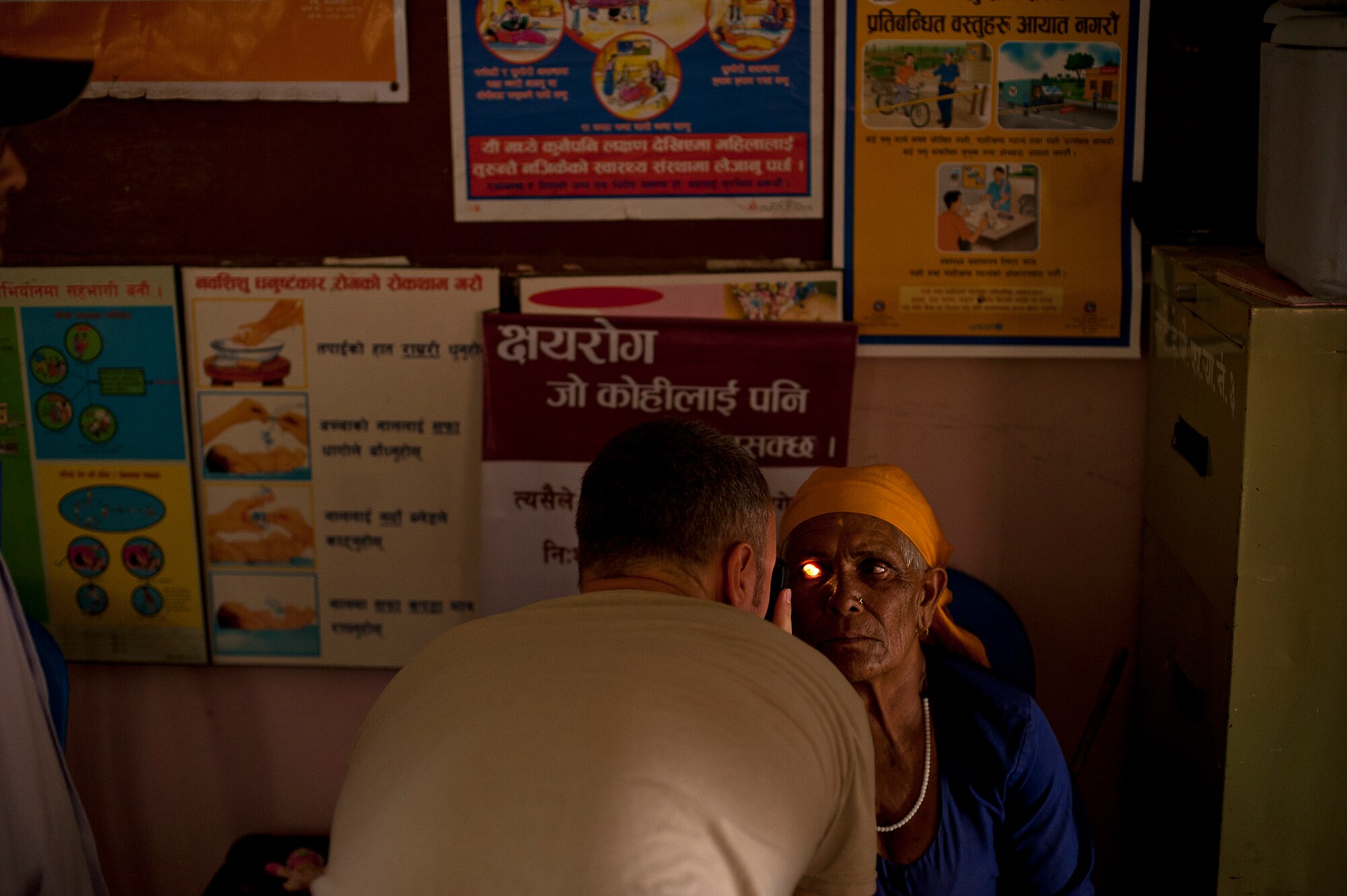 Maj. Brian Blanchard, optometrist, 56th Medical Group, Luke AFB, AZ treats a Nepali woman during U.S. Pacific Command's Operation Pacific Angel 12-4, Nepal on Sept. 10, 2012. During the first day more than 500 patients were treated at Nau Danda Health Post of Dhikur Pokhari Village Development Committee (VDC) of Kaski District. Pacific Angel 12-4 is a Pacific Air Forces planned event that enhances humanitarian assistance and disaster relief capabilities between the United States and Pacific partners. The U.S. was invited by the Nepal government to provide support by conducting medical, optometry, and civil engineering programs. Operations like Pacific Angel build and sustain relationships with our multinational partners in the Asia-Pacific region. (U.S. Air Force photo/Master Sgt. Jeffrey Allen)
