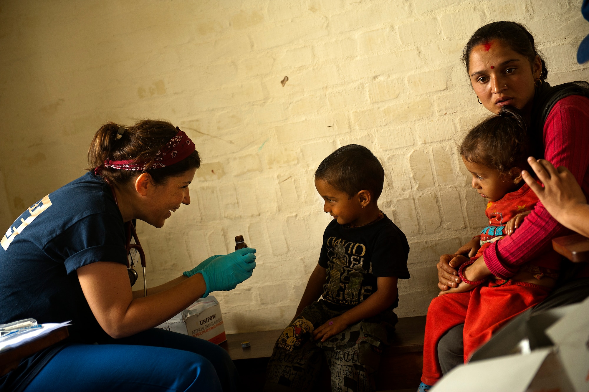 Onica Kuch, a Project HOPE pediatric nurse practitioner, gives a young Nepali boy medicine during U.S. Pacific Command's Operation Pacific Angel 12-4, Nepal on Sept. 10, 2012. During the first day over 500 patients were process and treated at Nau Danda Health Post of Dhikur Pokhari Village Development Committee (VDC) of Kaski District. Pacific Angel 12-4 is a Pacific Air Forces planned event that enhances humanitarian assistance and disaster relief capabilities between the United States and Pacific partners. The U.S. was invited by the Nepal government to provide support by conducting medical, optometry, and civil engineering programs. Operations like Pacific Angel build and sustain relationships with our multinational partners in the Asia-Pacific region. (U.S. Air Force photo/Master Sgt. Jeffrey Allen)
