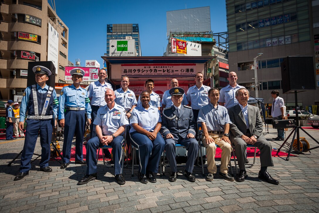 SHINAGAWA, Japan -- Pacific Trends, Band of the Pacific-Asia popular music ensemble, pose with members of the Takanawa Police Station during the bi-annual Traffic Safety Awareness Week, Shinagawa, Japan on Sept. 8, 2012. "We extend our deepest gratitude for [Pacific Trends'] participation in the 15th Takanawa Safety Fair and [their] significant contribution toward raising public awareness of traffic safety,' wrote Mr. Hiroshi Honma, Chief of Takanawa Polic Station. (U.S. Air Force photo by Staff Sgt. Josh Voyles)