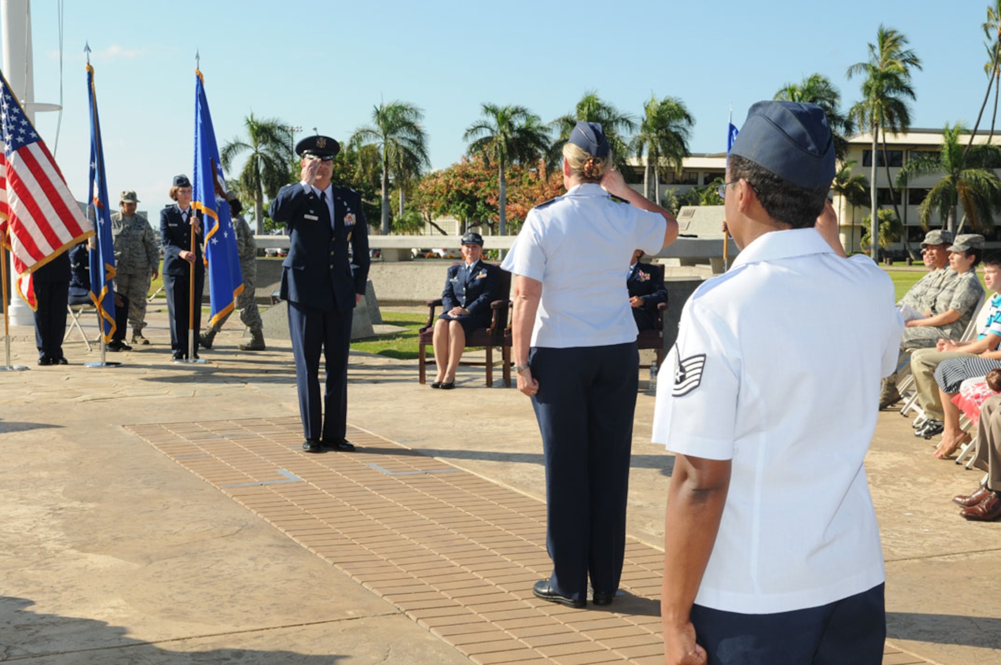 Lt. Col. Michael J. Fea, Commander, 15th Medical Operations Squadron, Joint Base Pearl Harbor-Hickam, Hawaii gets his first salute from squadron members after assuming command during a ceremony on 2 Aug 2012.  Photo by David D. Underwood, Jr.