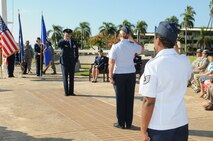 Lt. Col. Michael J. Fea, Commander, 15th Medical Operations Squadron, Joint Base Pearl Harbor-Hickam, Hawaii gets his first salute from squadron members after assuming command during a ceremony on 2 Aug 2012.  Photo by David D. Underwood, Jr.