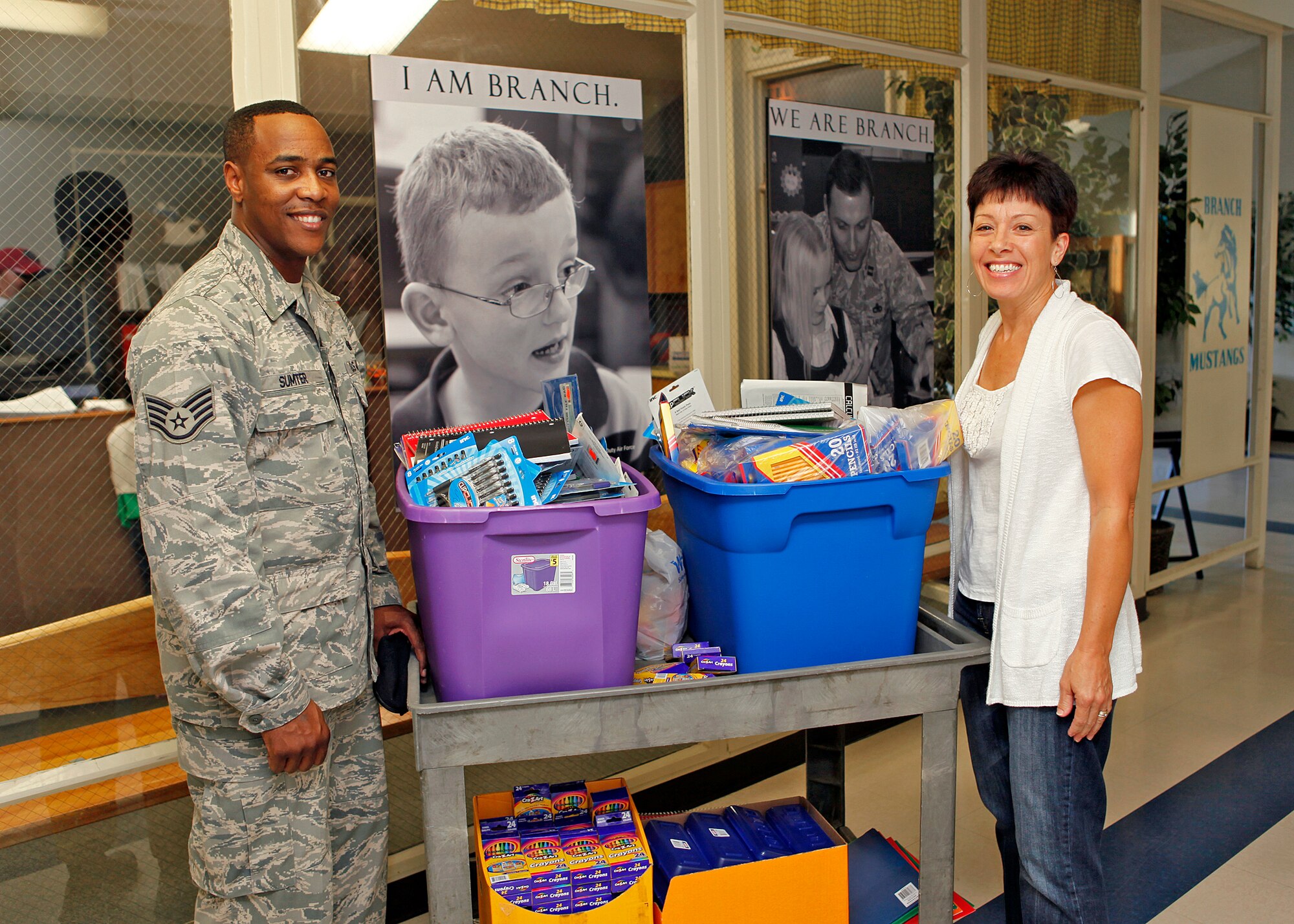 Staff Sgt. Devon Sumter, 412th Security Forces Squadron Pass and Identification clerk, and Ms. Kathleen Wilson, Irving L. Branch Elementary School principal, pose for a picture after Sergeant Sumter donated more than 200 school supply items to Irving L. Branch Elementary School Sep. 7, 2012. Ms. Wilson accepted the donations on behalf of the school. (U.S. Air Force photo by Jet Fabara)