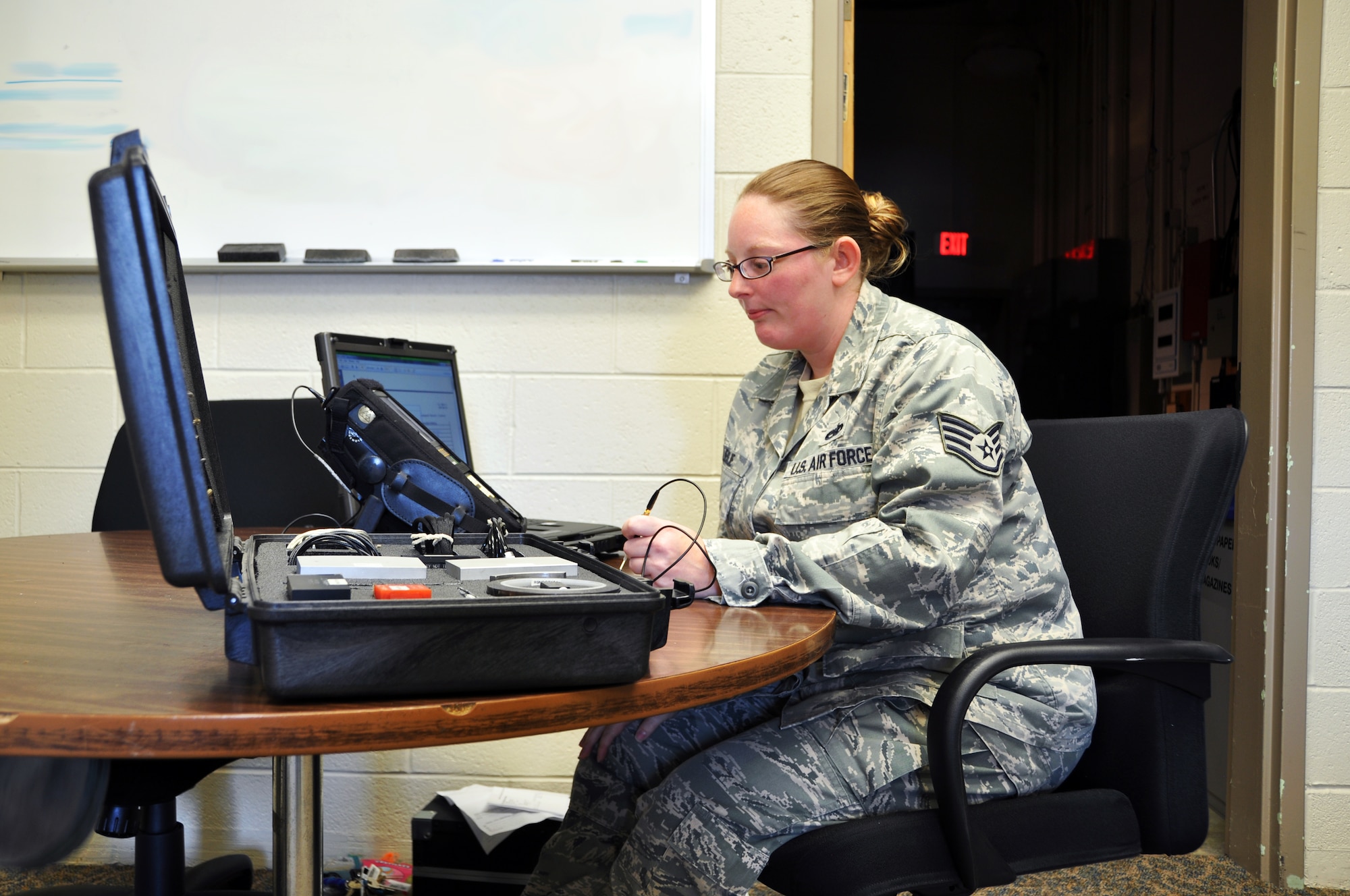 Staff Sgt. Kim Leslie, 94th Airlift Wing non-destructive inspection specialist, calibrates an eddy current machine, which will be used to detect cracks in metal parts of airframes. NDI specialists use eddy current machines, magnetic particle machines, ultrasonic detectors and portable X-Ray devices to peer into the aircraft and components without having to take them apart. (U.S. Air Force photo/Senior Airman Elizabeth Van Patten)