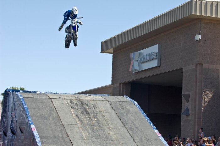 Ted Culbertson, Red Bull Jams motocross rider, jumps his bike for a crowd Sept. 8, 2012, at The Exchange here. The Red Bull Jams tour is putting on a show for servicemembers and their families across the U.S. (U.S. Air Force photo by Senior Airman Jack Sanders)