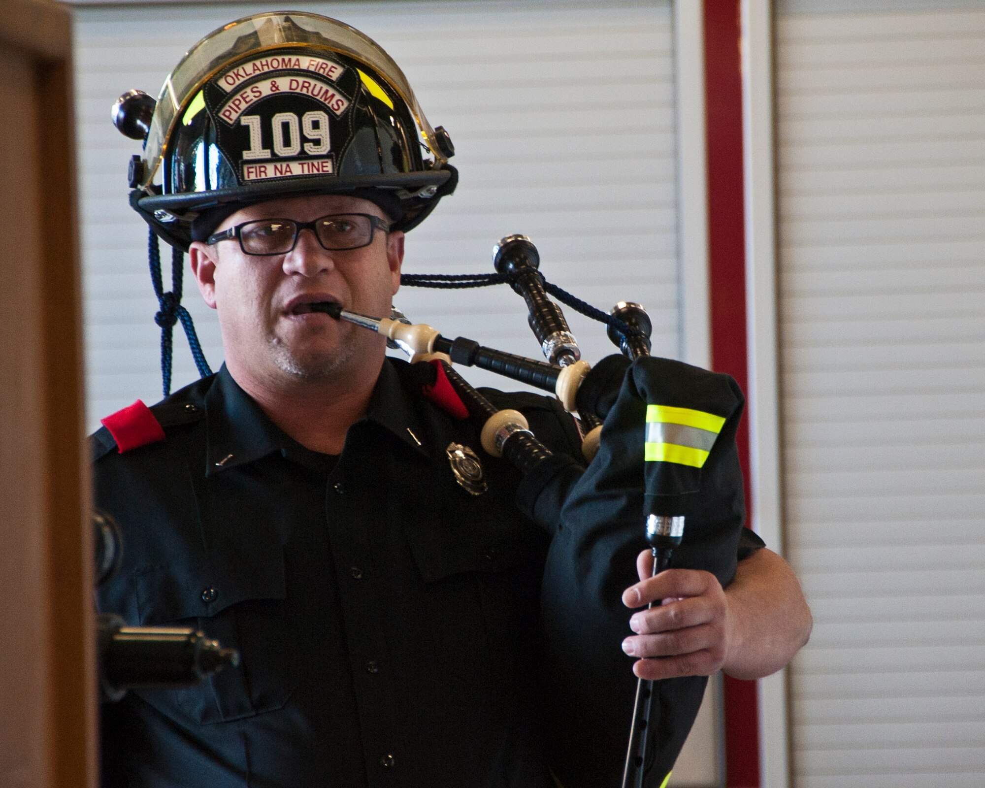 ALTUS AIR FORCE BASE, Okla. – Scot Finney, Oklahoma Fire Pipes and Drums bag piper, plays Amazing Grace during The Last Alarm Ceremony at the base Fire Department, Sept. 11, 2012. Finney is also a firefighter in Fort Sill, Okla. The Last Alarm Ceremony was conducted to honor the 343 firefighters who made the ultimate sacrifice Sept. 11, 2001. (U.S. Air Force photo by Senior Airman Kenneth W. Norman / Released / 97th Air Mobility Wing Public Affairs)