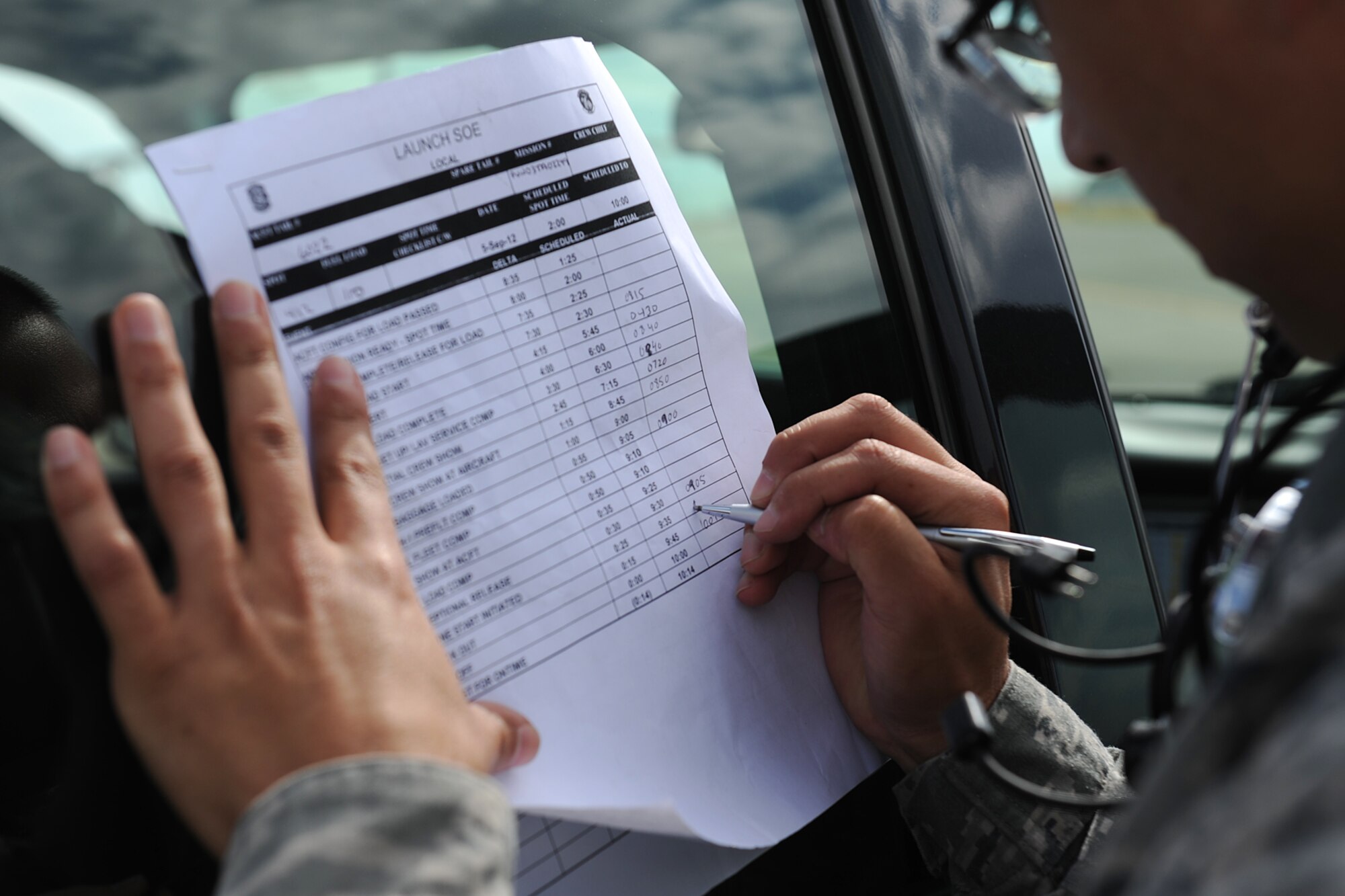 Staff Sgt. Sesar Gonzalez, assigned to the 571st Global Mobility Squadron, ensures accurate documentation of aircraft departure times during Exercise Gladiator Challenge. The exercise scenario included the CRW providing a contingency response team to respond to a simulated devastating earthquake in the San Francisco Bay area, which displaced 750, 000 simulated people. (U.S. Air Force Photo/MSgt Stan Parker)