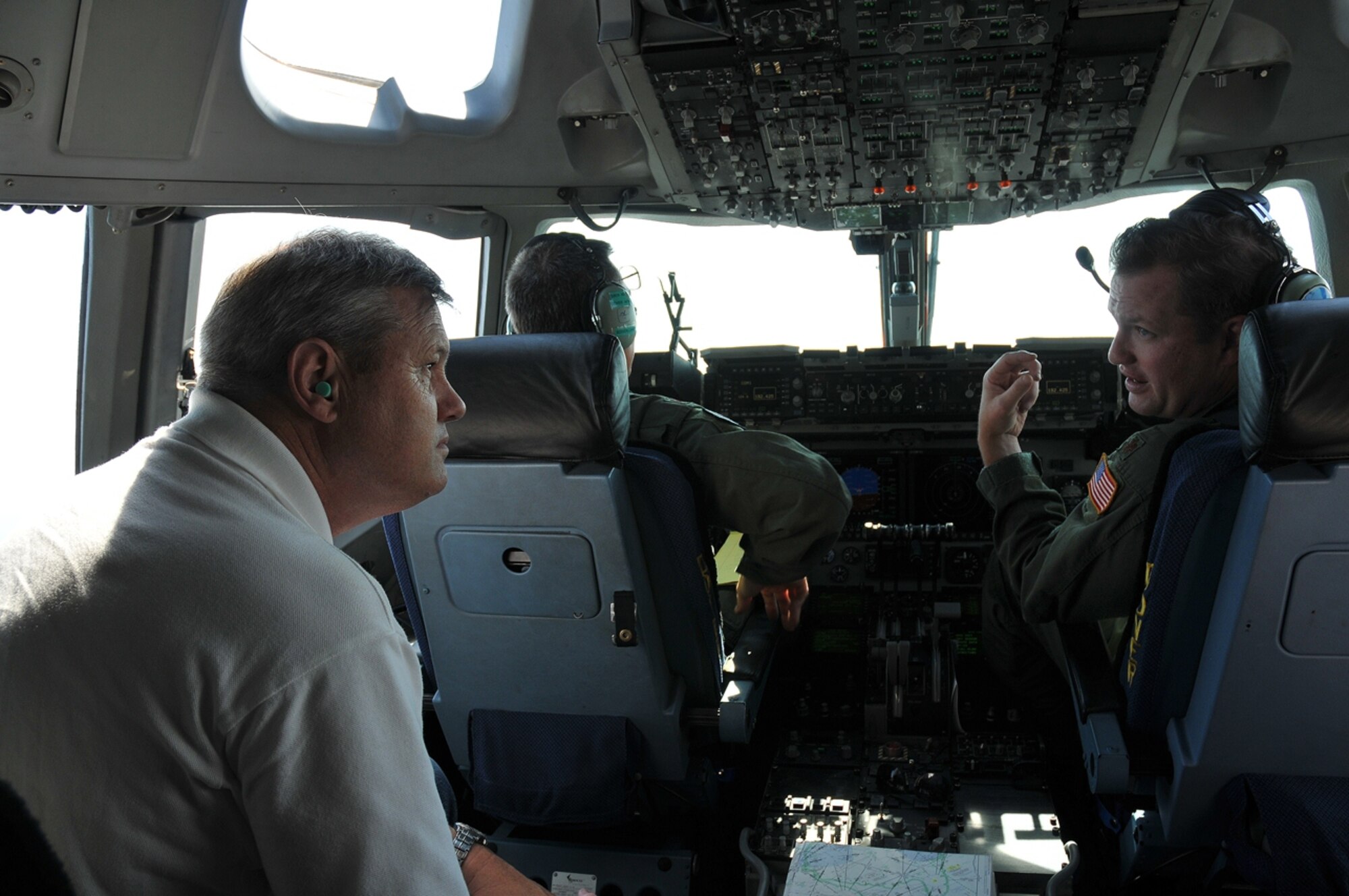 Gene Pulket (left) of Delaware's Employer Support of the Guard and Reserve program talks with pilot Maj. Henry Lasher Sept. 8, 2012, during a flight on a C-17 Globemaster III as part of the 512th Airlift Wing's annual Employer Appreciation Day. Pulket and three other ESGR represenatives attended the event, as did 23 employers or supervisors of Dover Air Force Base, Del, reservists. ESGR is a Department of Defense agency with a mission to promote a culture in which employers support and value the military service of their employees by advocating relevant intitiatives, recognizing outstanding employer support, increasing awareness of the law and resolving conflicts through mediation. (U.S. Air Force photo by Senior Airman Erika C. Brooke)