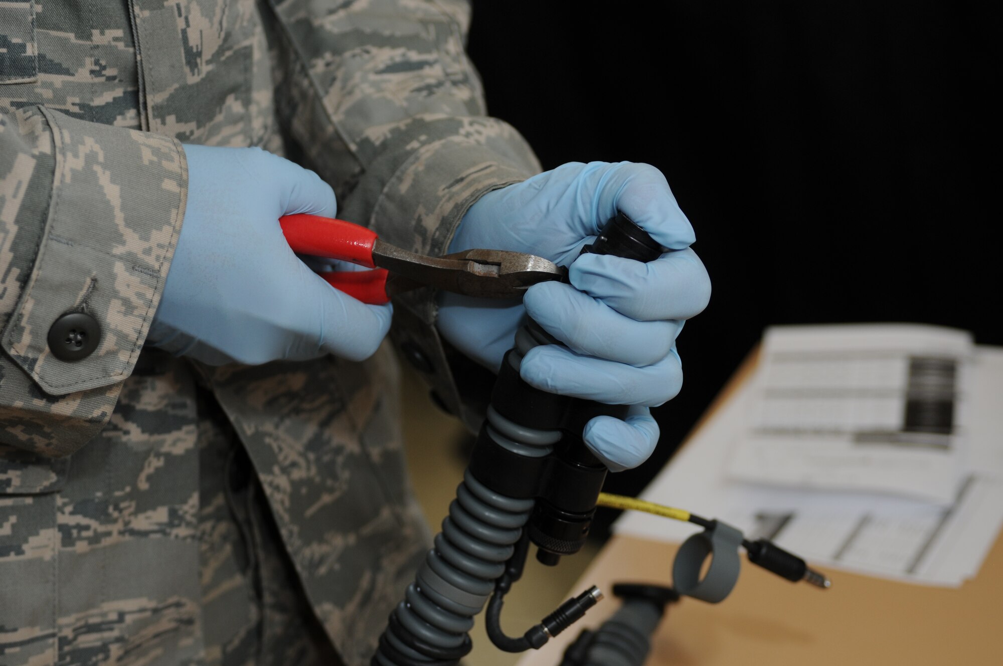 NAMEST AIR BASE, Czech Republic -- Senior Airman Brandon Keiper, 52nd Operations Support Squadron flight crew equipment maintainer, adjusts parts of a pilot's helmet as part of a 30-day inspection Sept. 10, during Ramstein Rover 2012 here.The 81st Fighter sqaudron is participating in RARO 12 to build partnerships and exchange tactics techniques and procedures with more than 16 NATO nations. A-10 Thunderbolt IIs from the 81st Fighter Squadron are providing close air support to partnering nations and practicing forward air control missions with their NATO allies in international security assistance force realistic scenarios throughtout the exercise. Participating in exercises like RARO 12 ensures effective employment of airpower in support of alliance or coalition forces while mitigating risks to civilians in contingency operations. (U.S. Air Force photo by Senior Airman Natasha Stannard/Released)