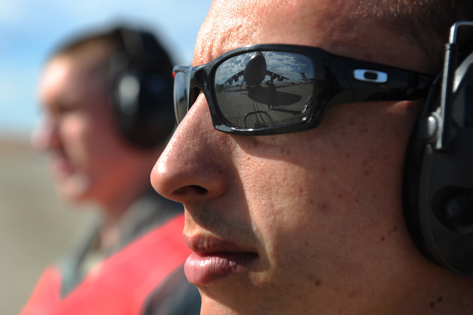 Senior Airman John Gondek, assigned to the 571st Global Mobility Squadron, looks on with a fire extinguisher during the pre-flight inspection a C-5 Galaxy during Exercise Gladiator Challenge. The exercise scenario included the CRW providing a contingency response team to respond to a simulated devastating earthquake in the San Francisco Bay area, which displaced 750, 000 simulated people.  (U.S. Air Force Photo/MSgt Stan Parker)