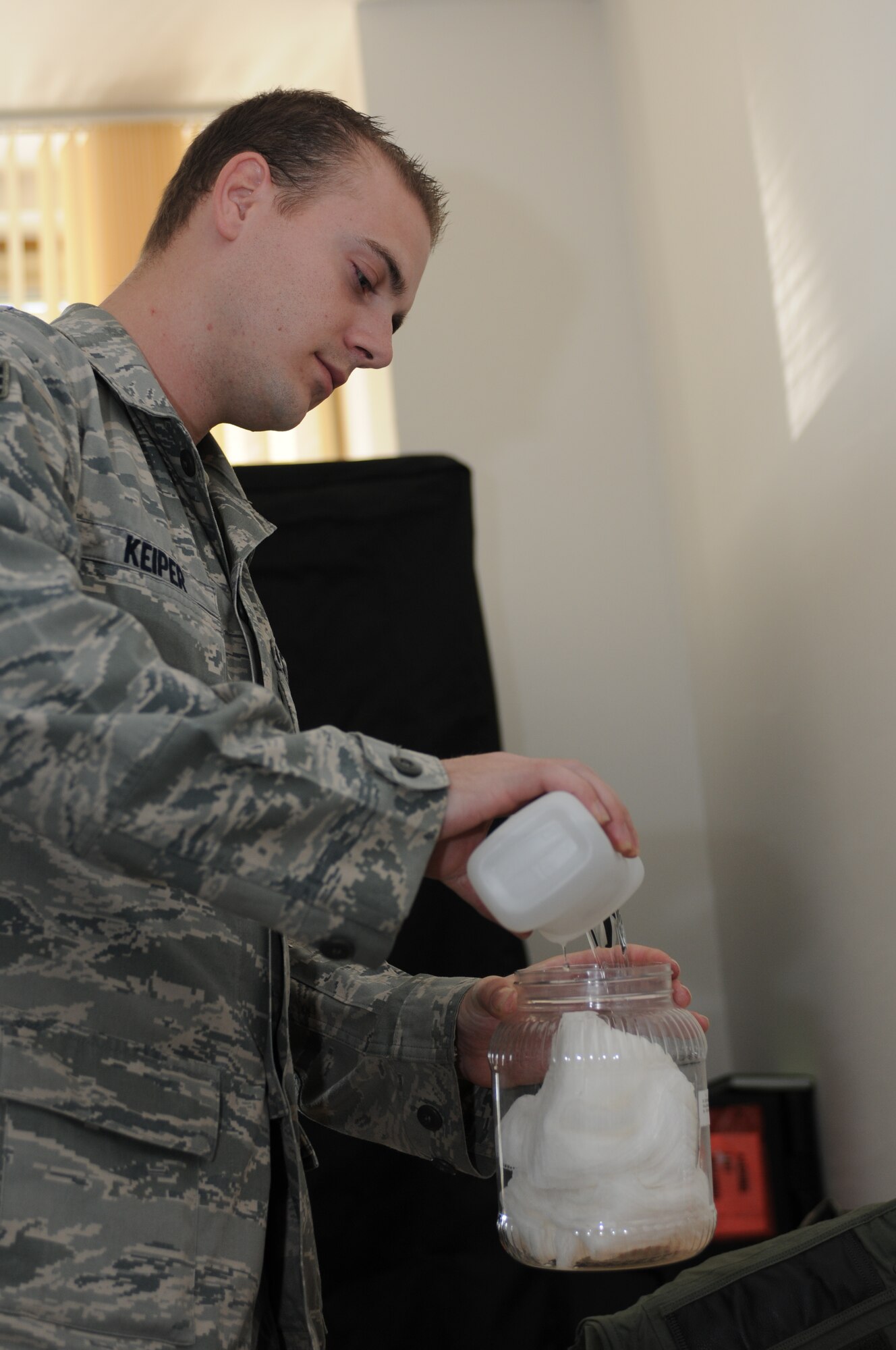 NAMEST AIR BASE, Czech Republic -- Senior Airman Brandon Keiper, 52nd Operations Support Squadron flight crew equipment maintainer, pours cleaning alcohol into a jar of cotton swabs used to clean flight equipment as part of a 30-day inspection Sept. 10, during Ramstein Rover 2012 here. RARO 12 is a NATO partnership building exercise invlolving more than 16 nations. A-10 Thunderbolt IIs from the 81st Fighter Squadron are providing close air support to partnering nations and practicing forward air control missions with their NATO allies in international security assistance force realistic scenarios throughtout the exercise. Participating in exercises like RARO 12 ensures effective employment of airpower in support of alliance or coalition forces while mitigating risks to civilians in contingency operations. (U.S. Air Force photo by Senior Airman Natasha Stannard/Released)