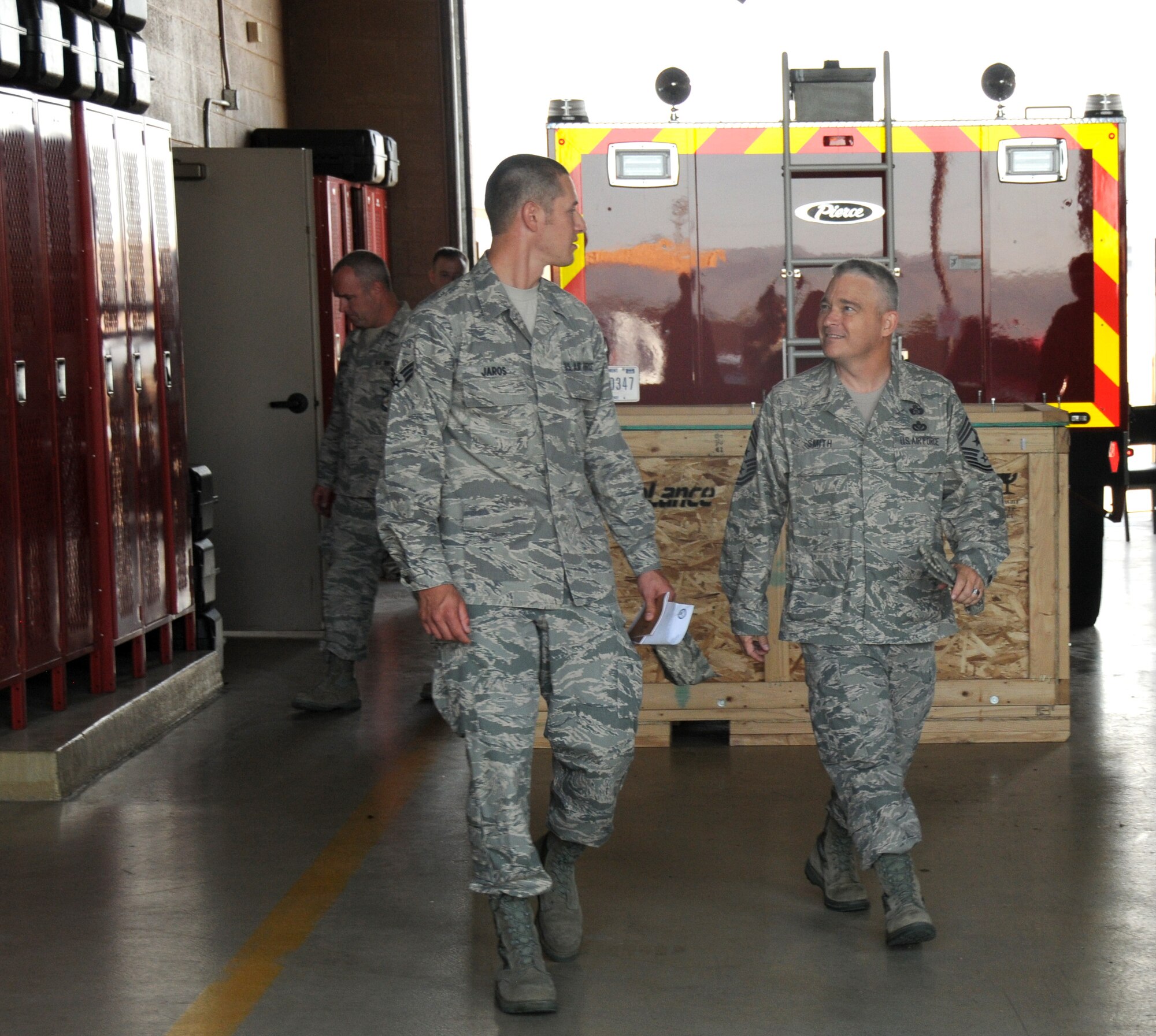 Chief Master Sgt. Johnny Smith,161st Air Refueling Wing command chief, and Senior Airman Anthony Jaros, 161st Maintenance Squadron, visit several shops on base, Sept. 9, 2012, at Phoenix Sky Harbor Air National Guard Base.  Airman Jaros was selected by the 161st Maintenance Group first sergeant to participate in the Day in the Life of the Command Chief, shadowing the command chief and learning about base history.  First-term Airmen assigned to the 161st Air Refueling Wing have a unique opportunity to experience a “Day in the Life” of the wing’s command chief. (U.S. Air Force photo by Senior Airman Rashaunda Williams/Released)