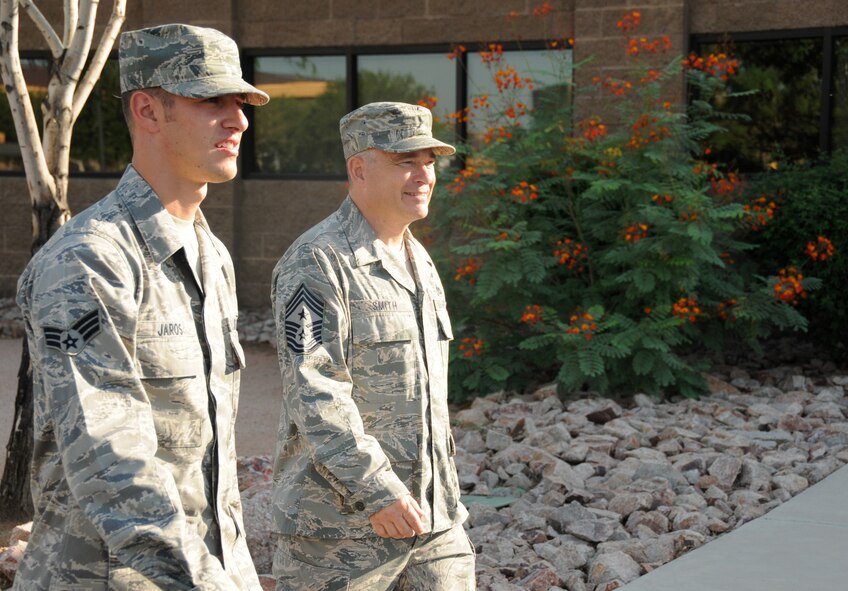 Chief Master Sgt. Johnny Smith,161st Air Refueling Wing command chief, and Senior Airman Anthony Jaros, 161st Maintenance Squadron, visit several shops on base, Sept. 9, 2012, at Phoenix Sky Harbor Air National Guard Base.  Airman Jaros was selected by the 161st Maintenance Group first sergeant to participate in the Day in the Life of the Command Chief, shadowing the command chief and learning about base history.  First-term Airmen assigned to the 161st Air Refueling Wing have a unique opportunity to experience a “Day in the Life” of the wing’s command chief. (U.S. Air Force photo by Senior Airman Rashaunda Williams/Released)