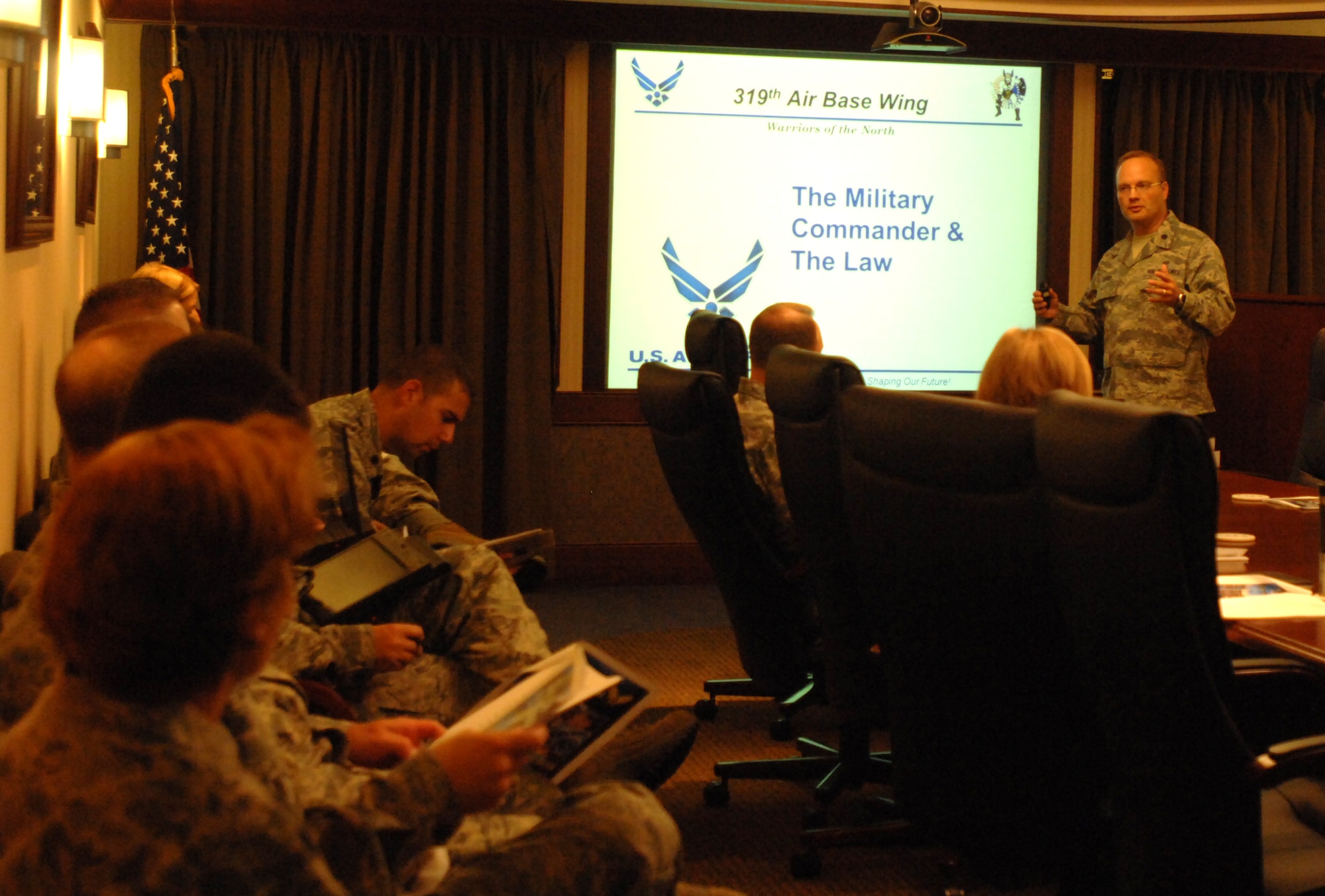 Lt. Col. Michael Safko, 319th Air Base Wing staff judge advocate, briefs Grand Forks AFB senior leaders on commanders and the law Sept. 7, 2012. The briefing covered a wide range of topics including an overview of routine services offered by the base legal assistance office, fitness discharges, disciplinary tools, line of duty determinations, dependent misconduct, and the area defense counsel. Safko said these sorts of briefings are typically held on an annual basis in late summer or early fall, because that is usually the time when new commanders have recently taken over the reins of their units. (U.S. Air Force photo by Senior Airman Susan L. Davis)