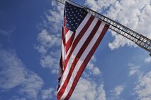 Maxwell Air Force Base Fire Department flies the American flag at half- staff, honoring those who lost their lives 11 years ago in New York City, Sept. 11. It is customary on Sept. 11 to fly the flag at half- staff from sunrise to sunset. (U.S. Air Force photo by Airman 1st Class William Blankenship)