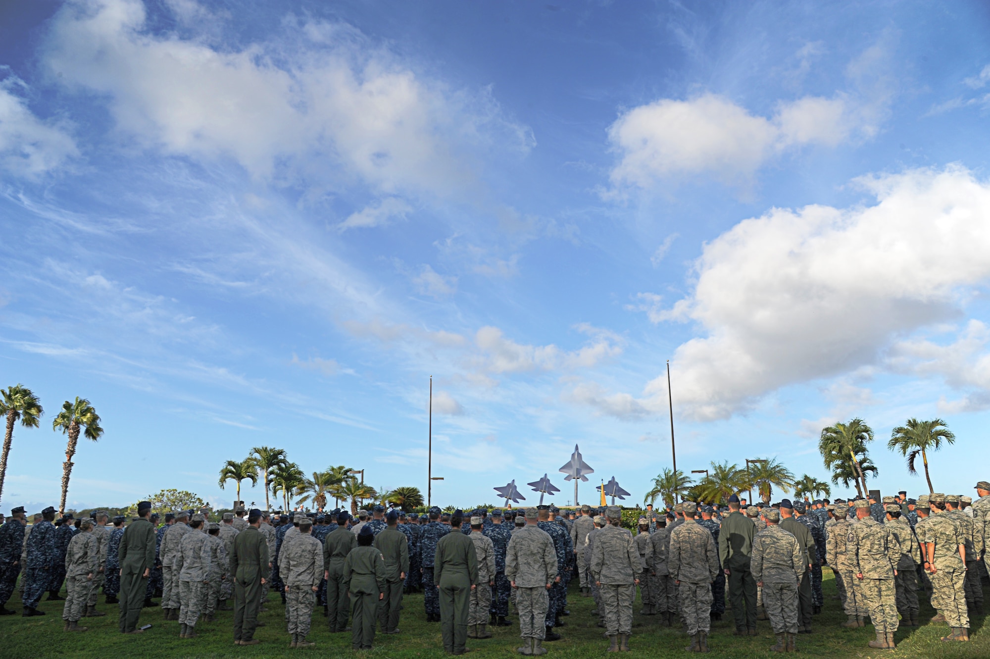 U.S. military members, alongside Federal Fire Department members, pay their respects during a Sept. 11th Remembrance Ceremony on Joint Base Pearl Harbor-Hickam, Hawaii, Sept. 11, 2012. This year marks the 11th anniversary of the attacks on the World Trade Center, the Pentagon, and the crash in Shanksville, Pennsylvania. (U.S. Air Force photo/Senior Airman Lauren Main)