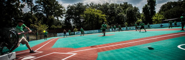 Airmen from the 437th Airlift Wing play a friendly game of baseball after cleaning up the Miracle League Ball Park, Sept. 7, 2012, at the Miracle League Ball Park in Summerville, S.C. Airmen from the 437th Airlift Wing volunteered to prepare the park for the upcoming season. The Miracle League provides opportunities for individuals with disabilities to play baseball. The Day of Caring, organized locally by the Trident United Way, saw more than 8,500 volunteers working on more than 300 projects around the Lowcountry. (U.S. Air Force photo/Senior Airman Dennis Sloan)Sloan)
