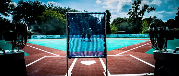 Airmen from the 437th Airlift Wing meet on the pitcher’s mound after cleaning up the Miracle League Ball Park, Sept. 7, 2012, in Summerville, S.C. Airmen from the 437th Airlift Wing volunteered to prepare the park for the upcoming season. The Miracle League provides opportunities for individuals with disabilities to play baseball. The Day of Caring, organized locally by the Trident United Way, saw more than 8,500 volunteers working on more than 300 projects around the Lowcountry. (U.S. Air Force photo/Senior Airman Dennis 
Sloan)
