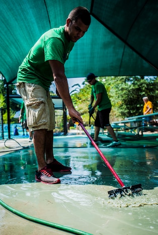 Airman 1st Class Randall Dieck, 437th Aircraft Maintenance Squadron jet mechanic, helps clear the water off concrete after being power washed Sept. 7, 2012, at the Miracle League Ball Park in Summerville, S.C. Dieck and several other Airmen from the 437th Airlift Wing volunteered to prepare the park for the upcoming season. The Miracle League provides opportunities for individuals with disabilities to play baseball. The Day of Caring, organized locally by the Trident United Way, saw more than 8,500 volunteers working on more than 300 projects around the Lowcountry. (U.S. Air Force photo/Senior Airman Dennis Sloan)