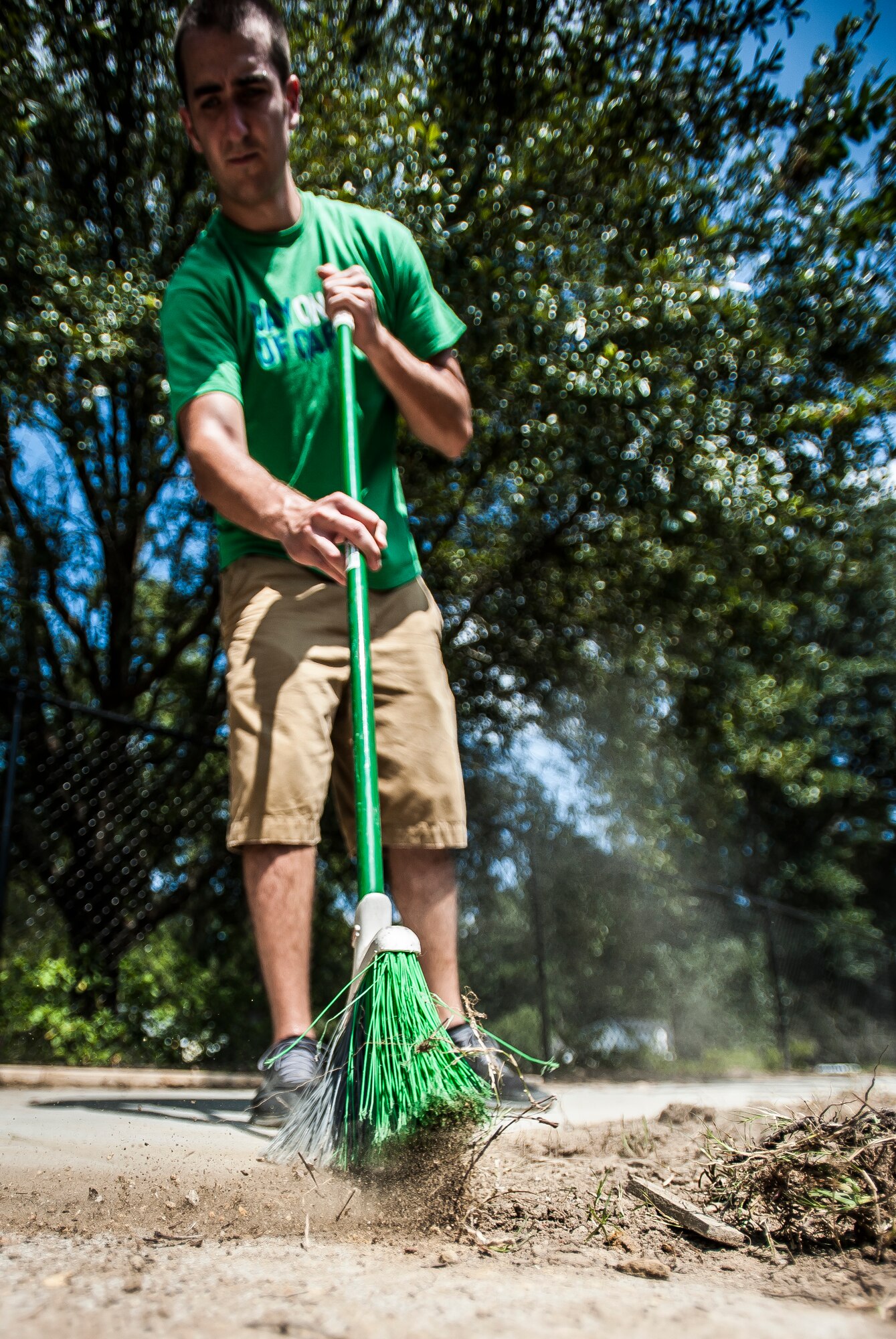 Senior Airman Zach Brammer, 437th Aircraft Maintenance Squadron crew chief, sweeps sidewalks Sept. 7, 2012, at the Miracle League Ball Park in Summerville, S.C. Brammer and several other Airmen from the 437th Airlift Wing volunteered to prepare the park for the upcoming season. The Miracle League provides opportunities for individuals with disabilities to play baseball. The Day of Caring, organized locally by the Trident United Way, saw more than 8,500 volunteers working on more than 300 projects around the Lowcountry. (U.S. Air Force photo/Senior Airman Dennis Sloan)
