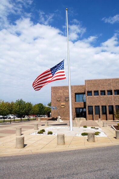 The flag is flown at half-staff in front of the 20th Fighter Wing building, Shaw Air Force Base, S.C.,  on the eleventh anniversary of  9/11, Sept. 11, 2012.  In 2001, President Bush proclaimed September 11th, as Patriot Day to honor the victims and heroes of the terrorist attacks on Sept. 11, 2011. (U.S. Air Force photo by Staff Sgt. Ave Young/Released)