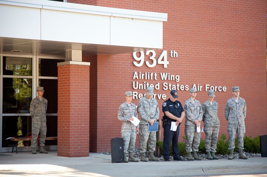 Readers during a Remembrance Ceremony at the 934th Airlift Wing observe a moment of silence in honor of those lost 9/11.  The wing held the ceremony on Sunday over the Unit Training Assembly weekend.  (U.S. Air Force Photo/Shannon McKay)
