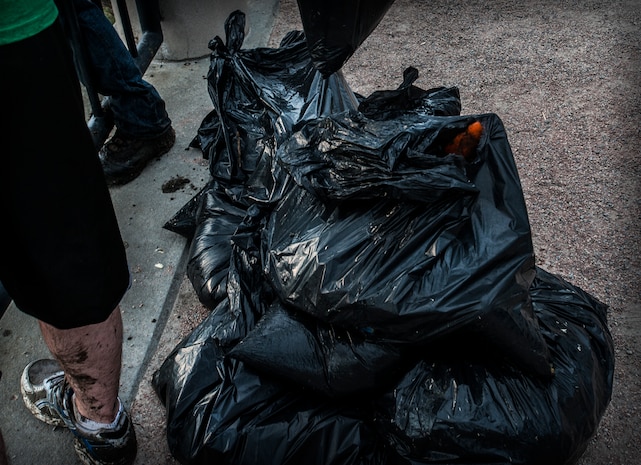 Bags of trash, collected from the muddy banks of the Waterfront Park, begin piling up as Joint Base Charleston – Air Base Airmen volunteer their time to help keep Charleston clean. More than 300 bags of trash were collected throughout the day by Airmen and “Keep Charleston Beautiful” volunteers.  The Day of Caring, organized locally by the Trident United Way, saw more than 8,500 volunteers working on more than 300 projects around the Lowcountry.
 (U.S. Air Force photo / Airman 1st Class Tom Brading)
