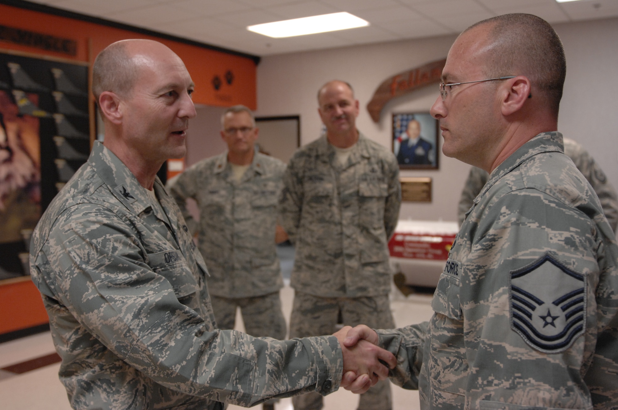 U.S. Air Force Col. Scott Ofsdahl, Air Combat Command command chaplain, recognized the leadership skills and the hard work of Master Sgt. Gregory Rush, 79th Aircraft Maintenance Unit production superintendent, at Shaw Air Force Base, S.C., Sept. 6, 2012. Ofsdahl was visiting Shaw’s chaplain core staff to see the effectiveness of chaplain’s programs and as part of the pastoral visit he was touring the 79th Squadron. (U.S. Air Force photo by Airman 1st Class Krystal M. Jeffers/Released)