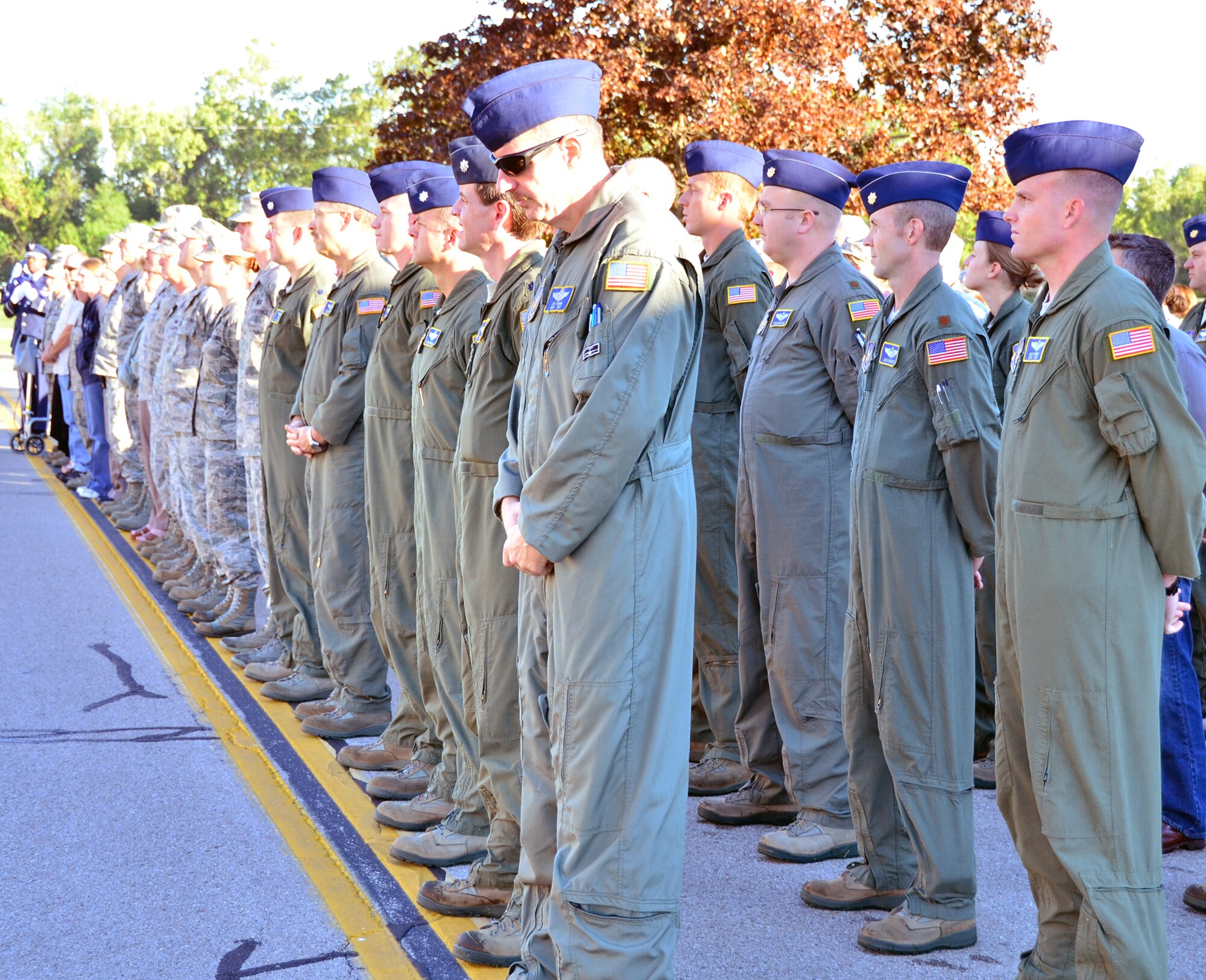 WRIGHT-PATTERSON AIR FORCE BASE, Ohio – The men and women of the 445th Airlift Wing pause for a moment of silence during the wing’s Patriot Day ceremony in front of the 445 AW Headquarters building Sept. 11, 2012. This year marks the eleventh year anniversary of the attacks. (U.S. Air Force photo/Stacy Vaughn)