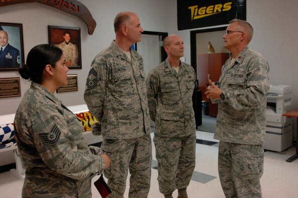 U.S. Air Force Maj. David Knight, 20th Fighter Wing chaplain, gives a tour to Col. Scott Ofsdahl, Air Combat Command command chaplain, and Chief Master Sgt. Richard Peters II, Air Combat Command chaplain assistant functional manager, around 79th Squadron at Shaw Air Force Base, S.C., Sept. 6, 2012. While he was there, Ofsdahl recognized the accomplishments of Airmen at Shaw. (U.S. Air Force photo by Airman 1st Class Krystal M. Jeffers/Released)