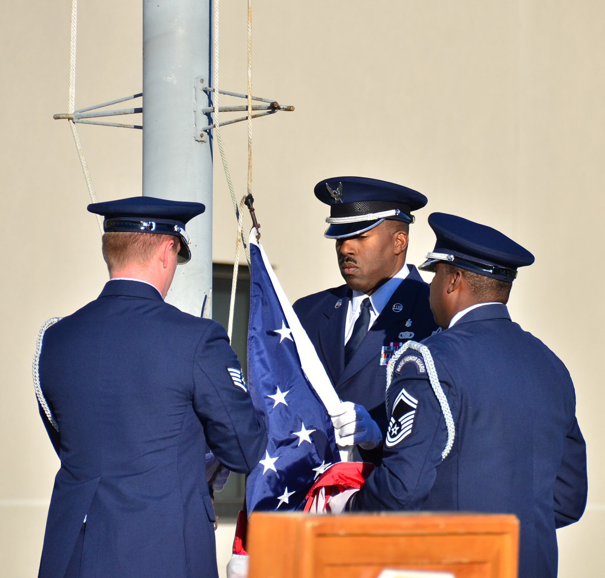 WRIGHT-PATTERSON AIR FORCE BASE, Ohio – The 445th Airlift Wing Honor Guard prepare to raise and lower the flag to half staff during the wing’s Patriot Day ceremony at the 445th AW Headquarters building Sept. 11, marking the eleven year anniversary of the attacks. (U.S. Air Force photo/Stacy Vaughn)