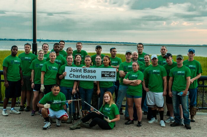 Airmen from Joint Base Charleston – Air Base pose before they begin cleaning the downtown marsh, Sept. 7, 2012 at the Waterfront Park in Charleston, S.C. The Waterfront Park cleanup was coordinated with the help of “Keep Charleston Beautiful,” a non-profit organization dedicated to promoting the cleanliness and beautification of the City of Charleston through education, public awareness and community involvement. The Day of Caring, organized locally by the Trident United Way, saw more than 8,500 volunteers working on more than 300 projects around the Lowcountry.
 (U.S. Air Force photo / Airman 1st Class Tom Brading)
