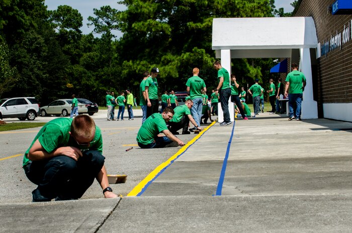 Students from the Naval Nuclear Power Training Command volunteer at Marrington Elementary School during the Day of Caring at Joint Base Charleston - Weapons Station, S.C. The Day of Caring, organized locally by the Trident United Way, saw more than 8,500 volunteers working on more than 300 projects around the Lowcountry. (U.S. Air Force photo/Airman 1st Class George Goslin)