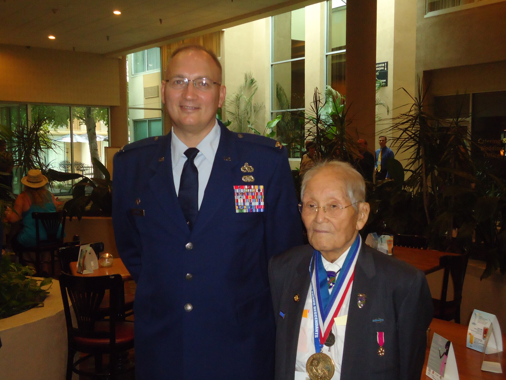 U.S. Air Force Col. Jeffery Decker, 23d Maintenance Group commander, poses for a photo with Roy Matsumoto at the Merrill’s Marauders Reunion in Louisville, Ky., Sept. 1, 2012. Matsumoto was a Japanese-language intelligence specialist with Merrill's Marauders, and he was awarded the Congressional Gold Medal along with other Nisei WWII veterans in November 2011. (Photo courtesy of U.S. Air Force Col. Jeffery Decker)
