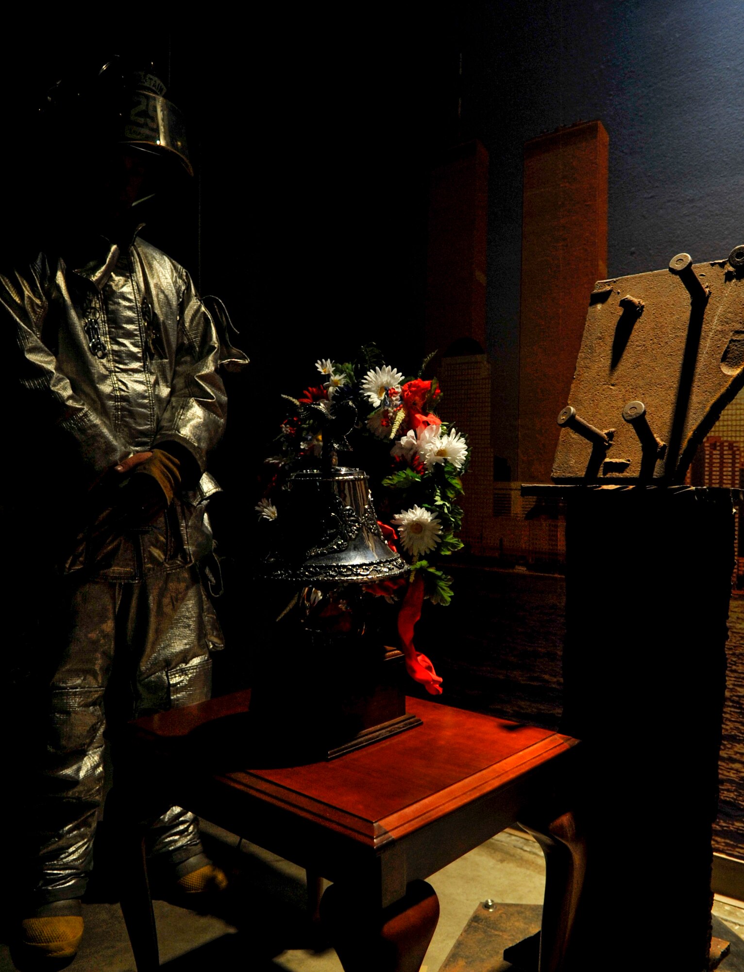 A firefighter stands at a memorial to remember and honor lives lost on 9/11. The memorial tribute took place Sept. 11, 2012, at Little Rock Air Force Base, Ark. (U.S. Air Force photo by Staff Sgt. Caleb Pierce) 
