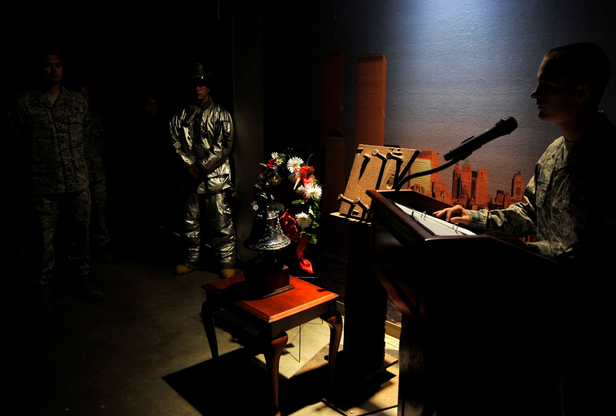 A 9/11 memorial tribute takes place at the Mobility Processing Center Sept. 11, 2012, at Little Rock Air Force Base, Ark. A permanent memorial in the Mobility Processing Center consisting of two pieces of the World Trade Center steel, one from the New York Fire Department Academy, the other from the Port Authority of New York/New Jersey. (U.S. Air Force photo by Staff Sgt. Caleb Pierce)