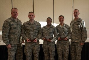 Colonel Erik Hansen, 437th Airlift Wing commander and Chief Master Sgt. Larry Williams, 437th Airlift Wing command chief, pose with the Diamond Sharp Award winners Sept. 11, 2012, at Joint Base Charleston – Air Base, S.C. (Left to right) Senior Airmen Joshua DeJongh, 437th Aircraft Maintenance Squadron, Airman 1st Class Tiffany Nunn, 437th Maintenance Squadron and Airman 1st Class Meghan Wendel, 437th Operations Support Squadron were recognized. Not pictured is Staff Sgt. Brandon Doyle, 437th Aerial Port Squadron. The Diamond Sharp award recognizes Airmen whose outstanding performance stands out to their first sergeant. (U.S. Air Force photo/Airman 1st Class Ashlee Galloway)