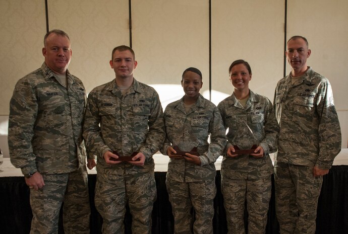 Colonel Erik Hansen, 437th Airlift Wing commander and Chief Master Sgt. Larry Williams, 437th Airlift Wing command chief, pose with the Diamond Sharp Award winners Sept. 11, 2012, at Joint Base Charleston – Air Base, S.C. (Left to right) Senior Airmen Joshua DeJongh, 437th Aircraft Maintenance Squadron, Airman 1st Class Tiffany Nunn, 437th Maintenance Squadron and Airman 1st Class Meghan Wendel, 437th Operations Support Squadron were recognized. Not pictured is Staff Sgt. Brandon Doyle, 437th Aerial Port Squadron. The Diamond Sharp award recognizes Airmen whose outstanding performance stands out to their first sergeant. (U.S. Air Force photo/Airman 1st Class Ashlee Galloway)