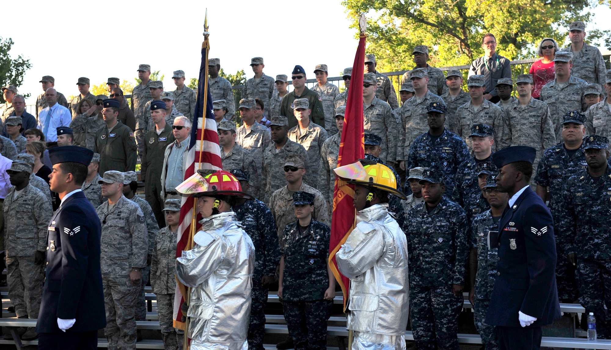 Team Scott members post the Colors as the audience salutes during the 2012 9/11 remembrance ceremony on Scott Air Force Base, Ill.  (U.S. Air Force photos/ Staff Sgt. Stephenie Wade)    
