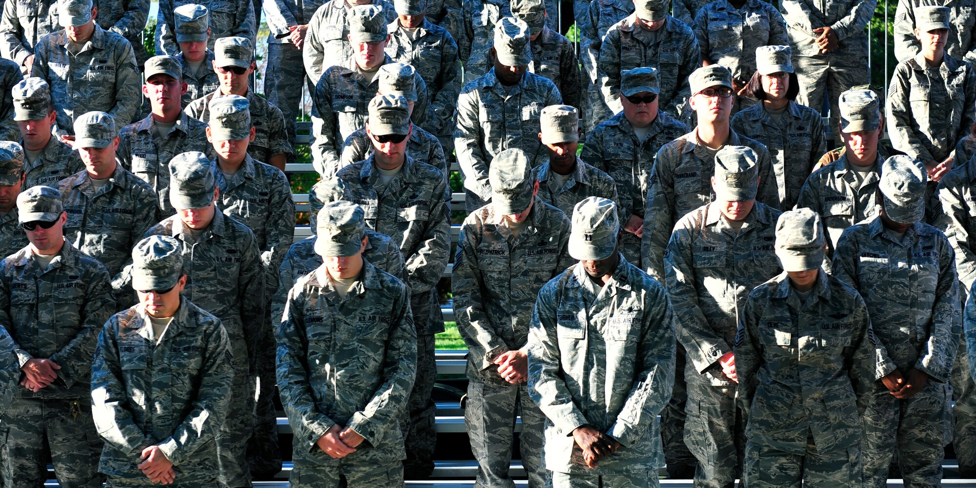 Team Scott members pause and participate in a moment of silence during the 2012 9/11 remembrance ceremony on Scott Air Force Base, Ill.  (U.S. Air Force photos/ Staff Sgt. Stephenie Wade)    
