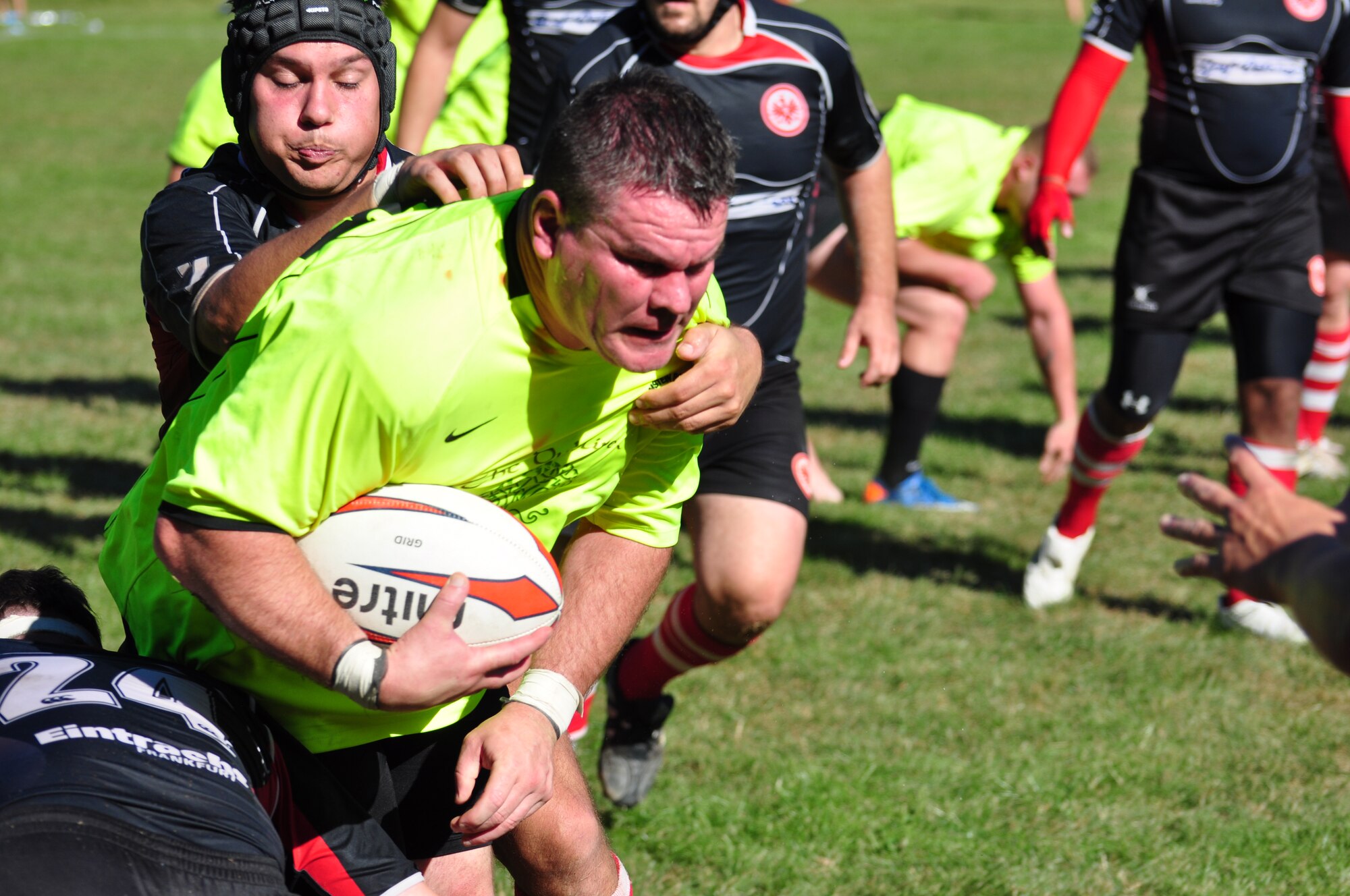 Master Sgt. Shane Hiett, 86th Aircraft Maintenance Squadron flight chief, runs the ball for the Ramstein Rogues during a Division-II rugby match at the Queidersbach SportPlatz Sept. 8, 2012. The Rogues beat the Eintracht Frankfurt team 45-15. (U.S. Air Force photo/Tech. Sgt. Chad Thompson)