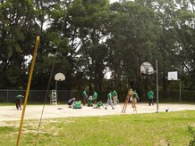 Chief petty officers and chief petty officer selects work together to tape and paint a basketball court Sept. 7, at Jane Edwards Elementary School, Edisto Island, S.C. The Day of Caring, organized locally by the Trident United Way, saw more than 8,500 volunteers working on more than 300 projects around the Lowcountry. (U.S. Navy photo/Chief Petty Officer Michael Vira)