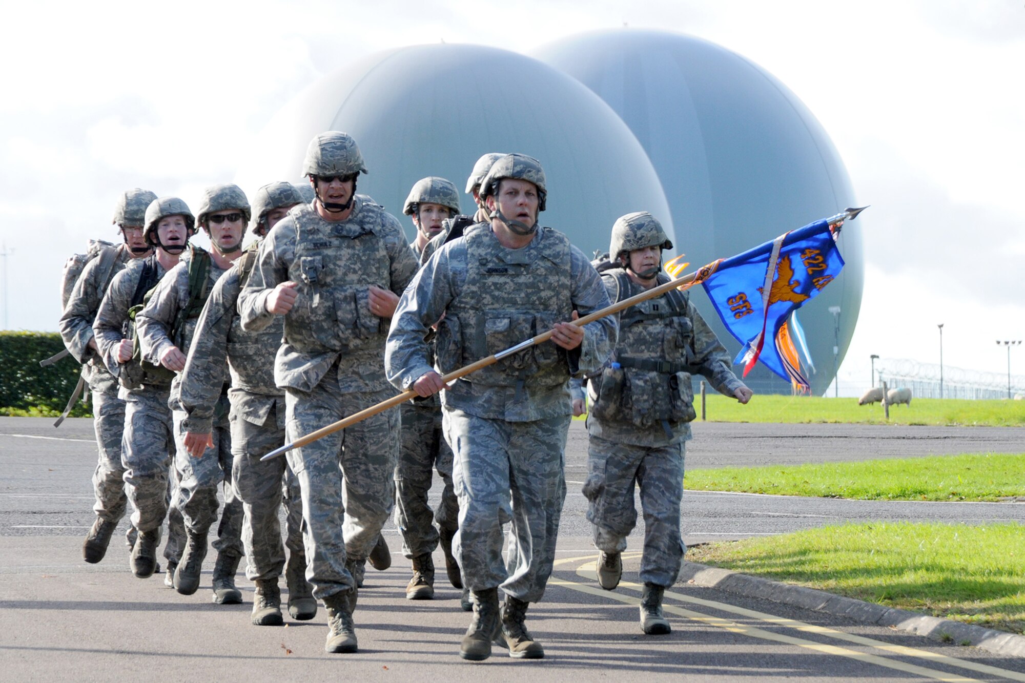 RAF CROUGHTON, United Kingdom – Members of the 422nd Security Forces Squadron participate in the 9/11 Memorial Ruck March Sept. 11 at the RAF Croughton track. The 3.35-mile ruck march had three classes: Military Heavy (uniforms with a 30-pound ruck); Military Light (uniform only, no ruck); and PT Gear. (U.S. Air Force photo by Master Sgt. Randy Hillsgrove)