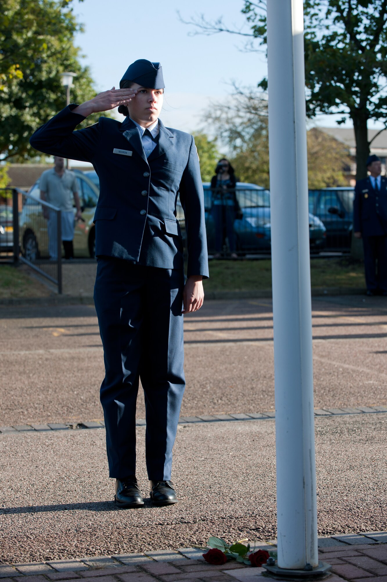 RAF ALCONBURY, United Kingdom – An Alconbury High School JROTC cadet salutes during the 423rd Air Base Group 9/11 Remembrance Ceremony at the school flagpole Sept. 11. This year marked the 11th anniversary of the attacks. (U.S. Air Force photo by Master Sgt. John Barton)