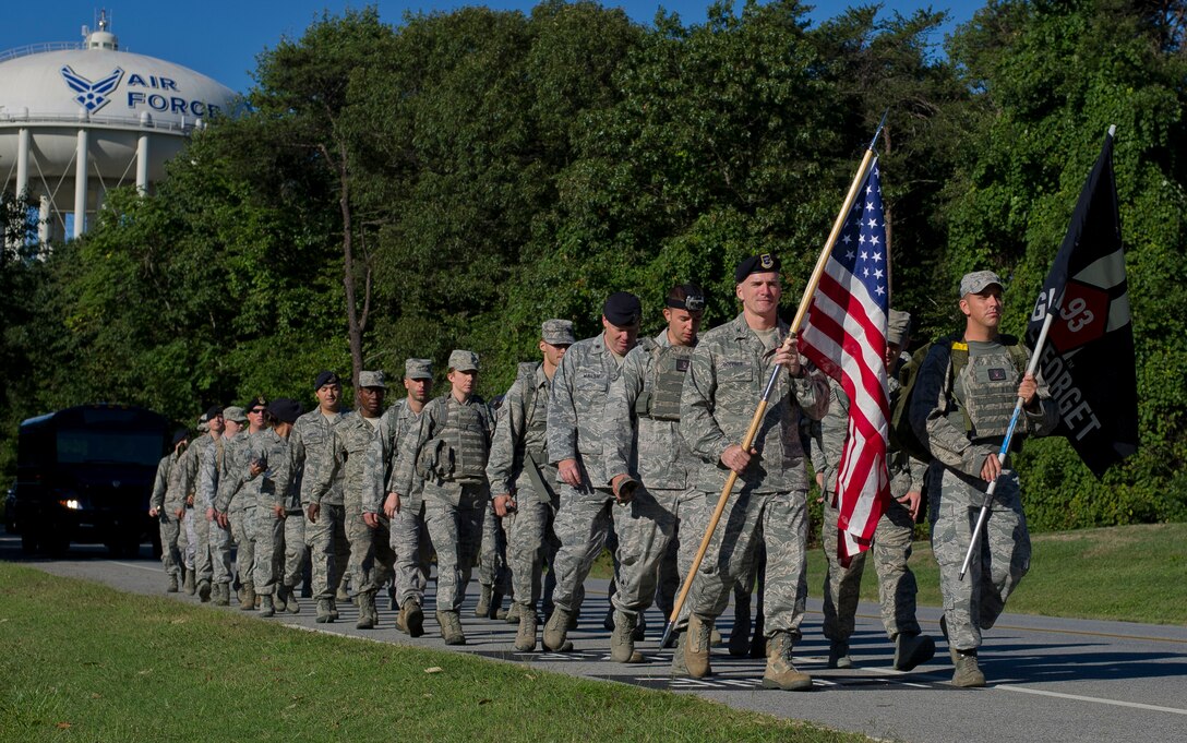 Airmen from the 11th Security Forces Group participate in a 9/11 Memorial Ruck 
March Sept. 11, 2012, at Joint Base Andrews, Md. More than 25 Airmen participated in the three-hour march which stretched a total distance of 9 miles and 11,000 meters around the perimeter of the installation. (U.S. Air Force Photo/Senior Airman Perry 
Aston)
