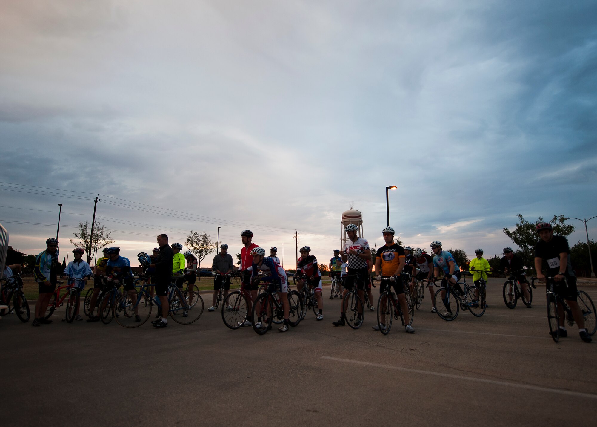 Participants gather in front of the fitness center Sept. 8, 2012, before the second annual Le Tour De Dyess at Dyess Air Force Base, Texas. The race began at the fitness center and weaved 26-miles throughout Dyess. (U.S. Air Force photo by Airman 1st Class Damon Kasberg/Released)