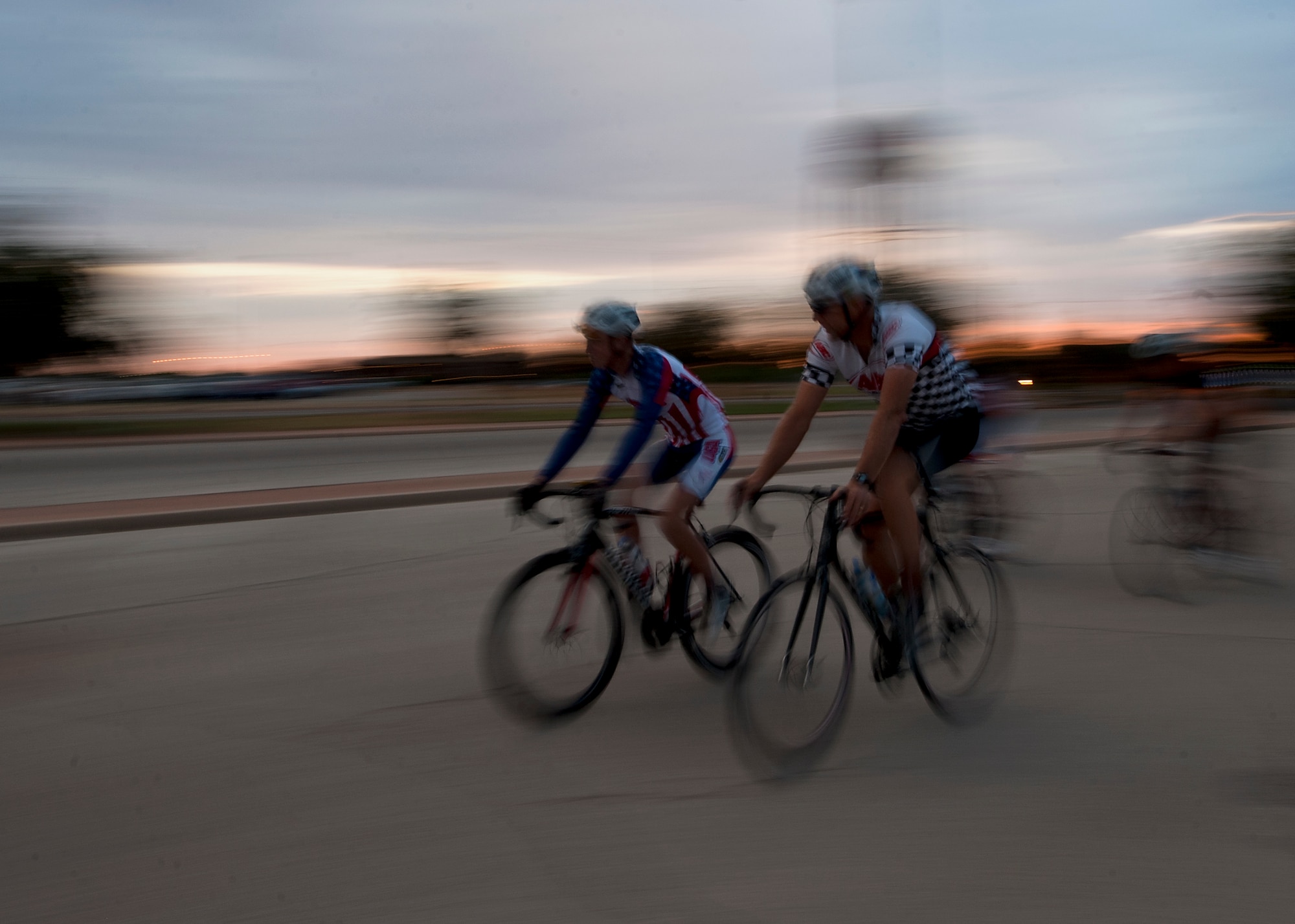 Cyclists warm up Sept. 8, 2012, before the second annual Le Tour De Dyess at Dyess Air Force Base, Texas. The race began at the fitness center and weaved 26-miles throughout Dyess.  (U.S. Air Force photo by Airman 1st Class Damon Kasberg/Released)